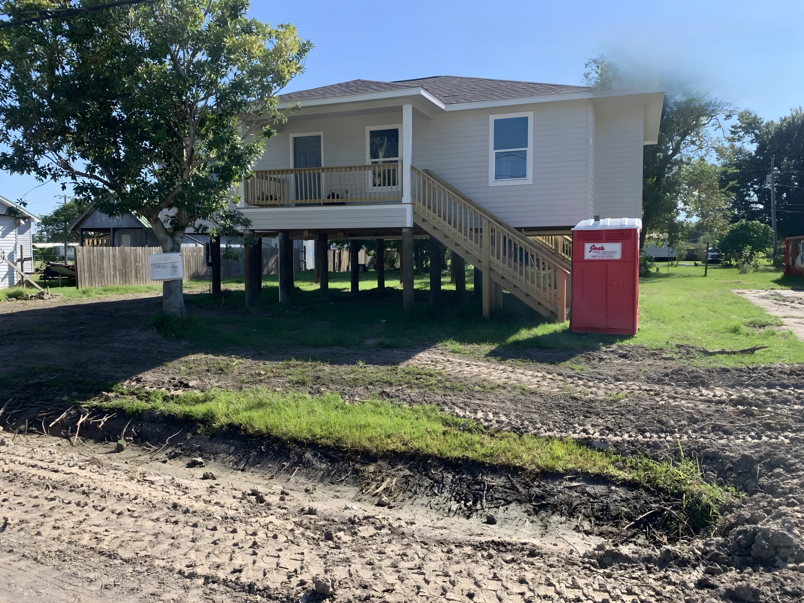 Completed elevated home exterior after reconstruction