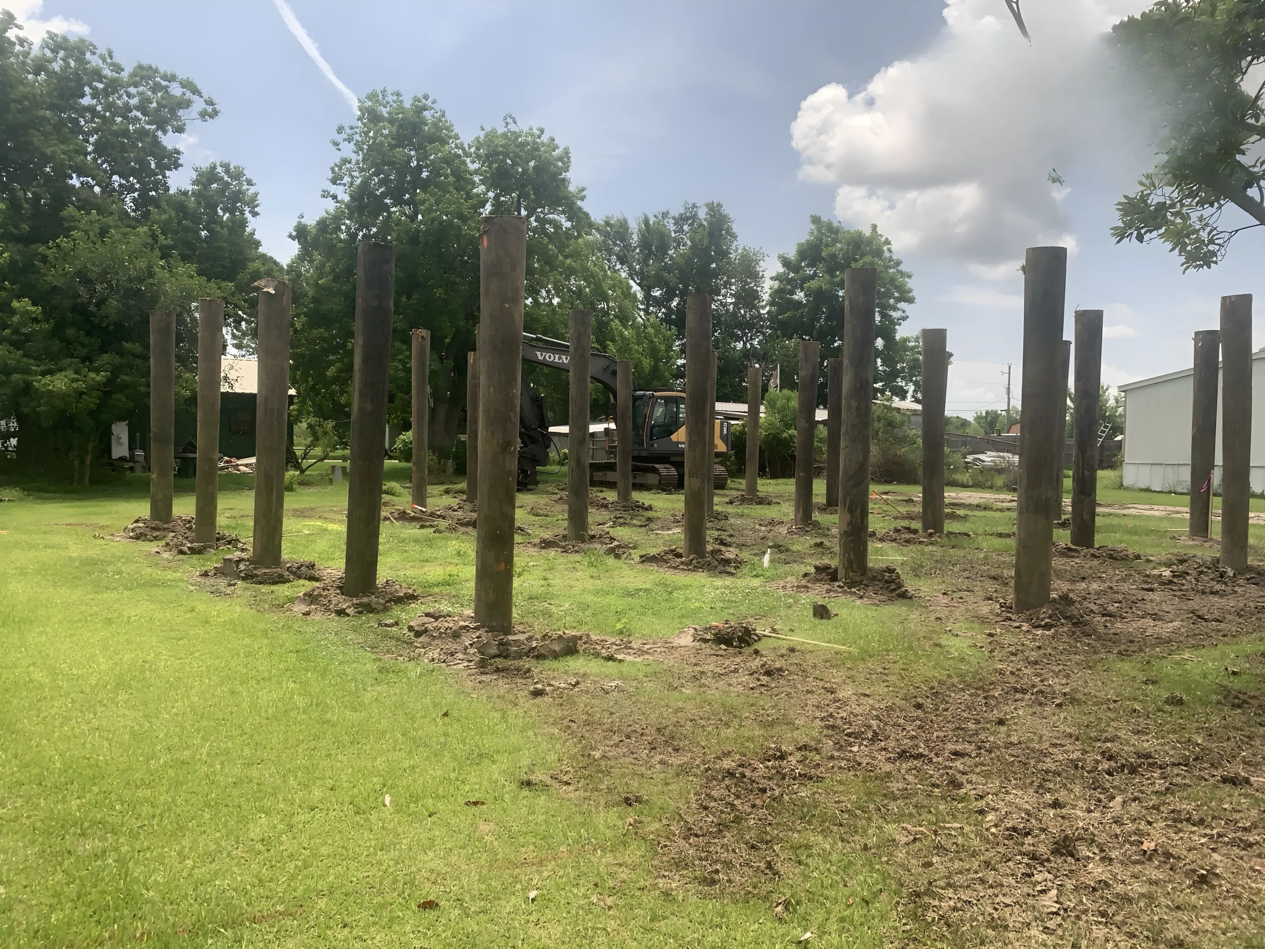 Active site preparation with pilings and excavation equipment