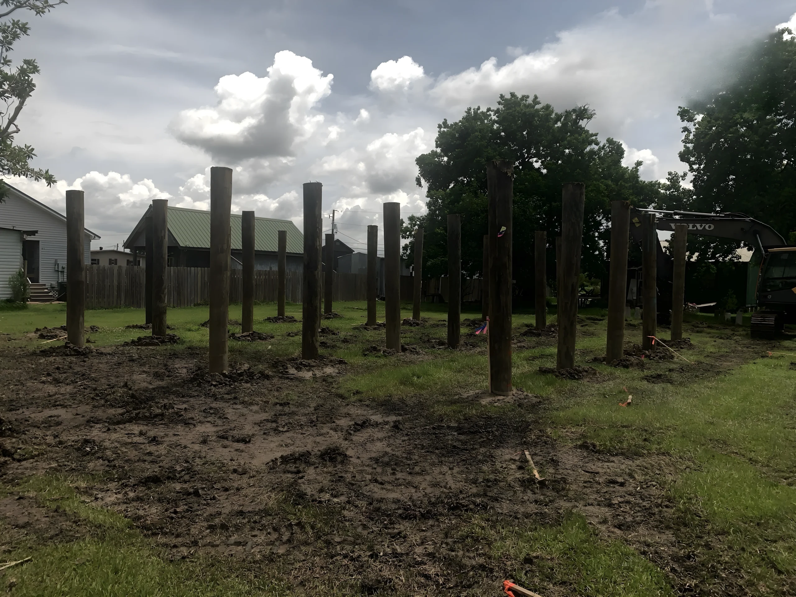 Site operations with installed pilings and active equipment